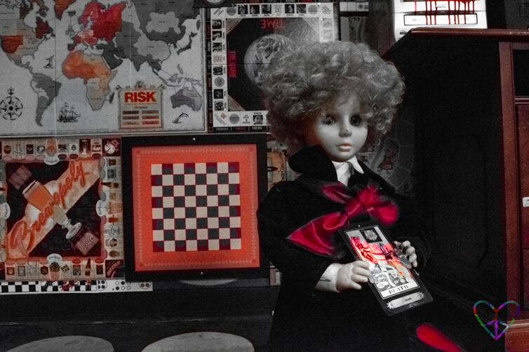 A creepy doll in Atlas Escape Rooms' The Collector game
